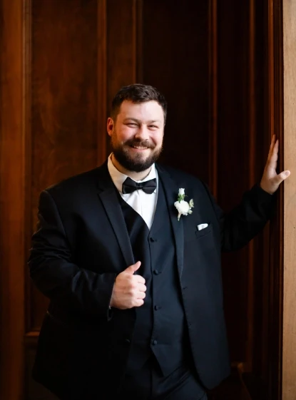 man wearing a black suit