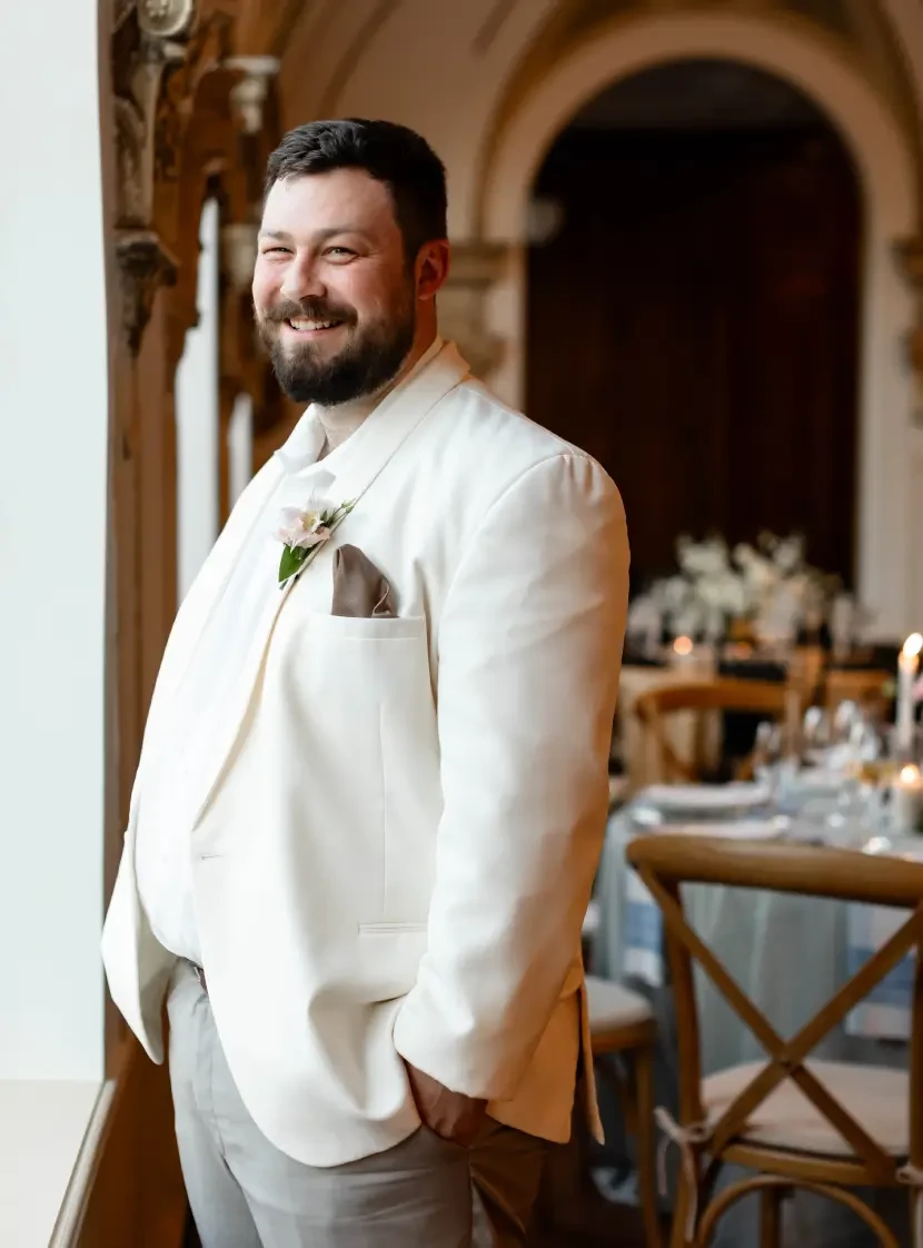 man wearing a white suit